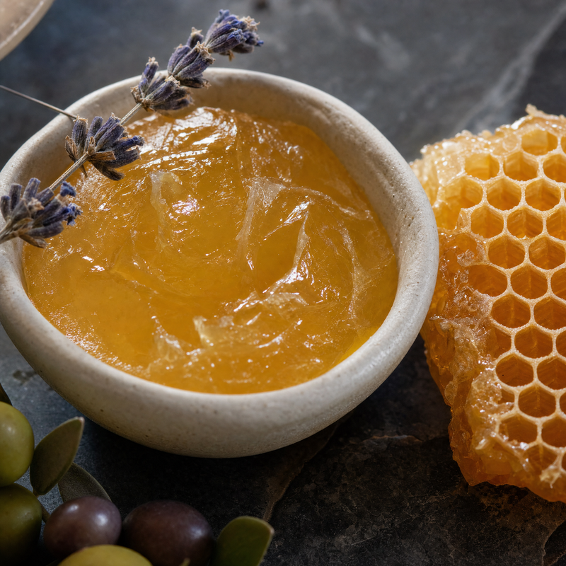Honey-tallow balm being applied to skin